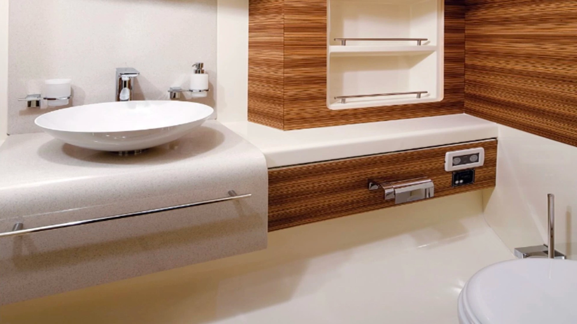 Modern enclosed bathroom aboard a 38' Chris-Craft Boat Rental in Riviera Beach with contemporary vanity and premium finishes.