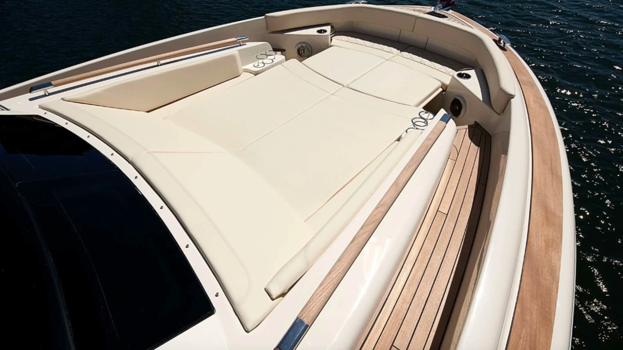 38' Chris-Craft Boat Rental featuring a spacious bow sun pad with premium lounge seating in Riviera Beach.