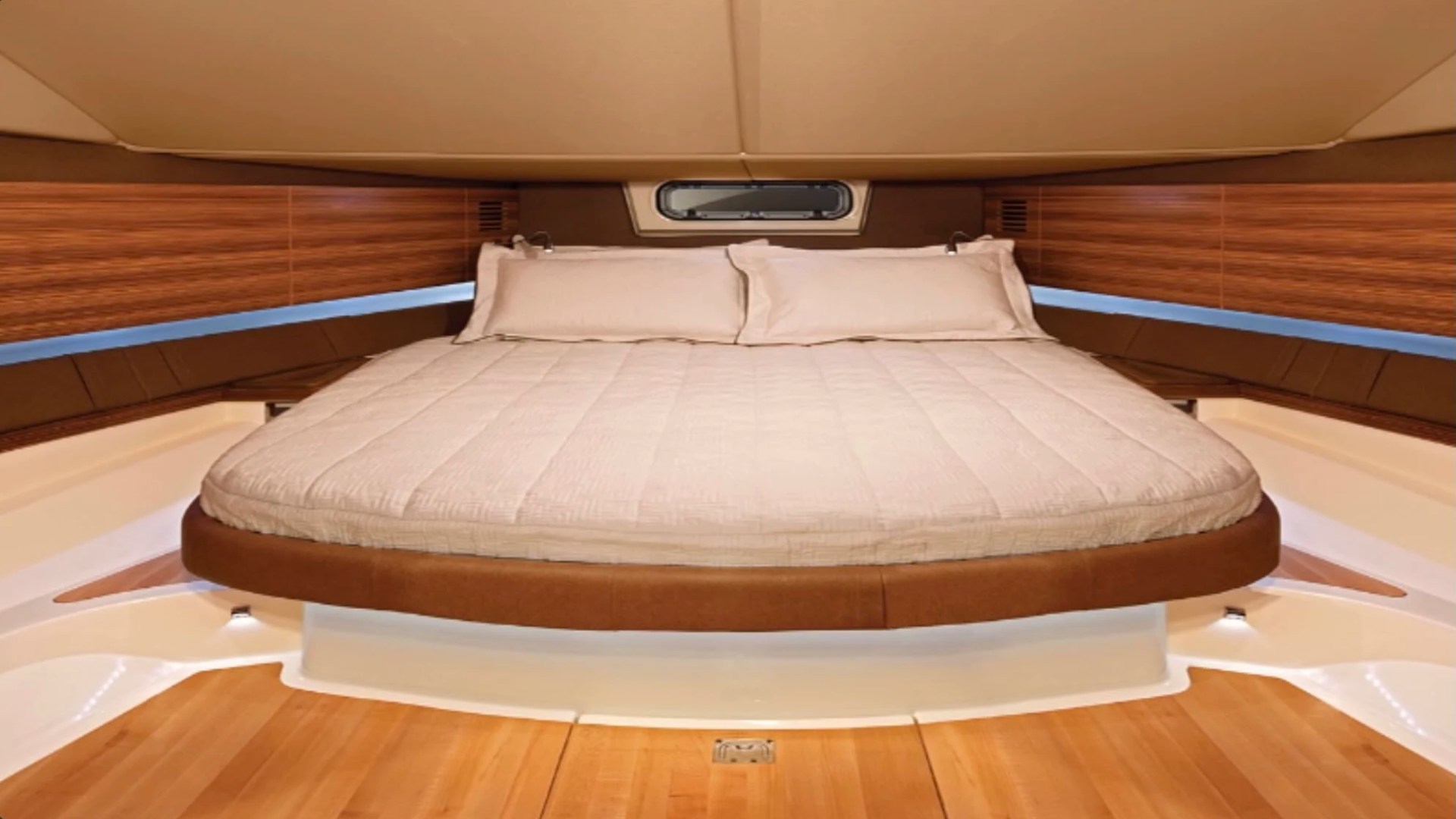 38' Chris-Craft Boat Rental featuring a private forward cabin with a spacious island berth and premium wood finishes in Riviera Beach.
