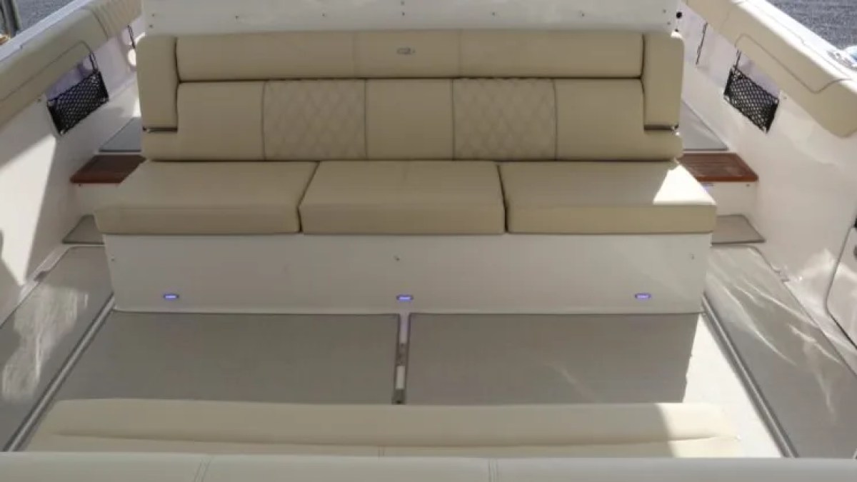38' Regal Boat Rental aft cockpit bench seating with open entertainment deck in Riviera Beach Florida.