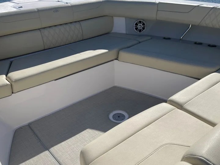 38' Regal Boat Rental spacious bow lounge with wraparound seating in Riviera Beach Florida.