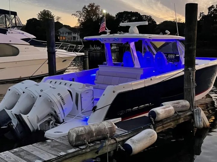38' Regal Boat Rental docked at sunset with blue LED lighting in Riviera Beach Florida.