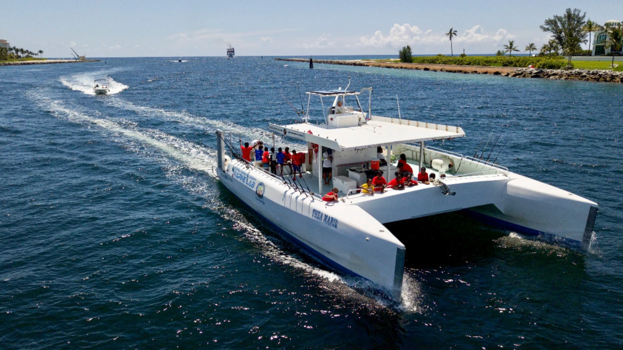 49' PowerCat Boat Rental cruising from Riviera Beach Inlet with guests enjoying a private South Florida boating adventure.