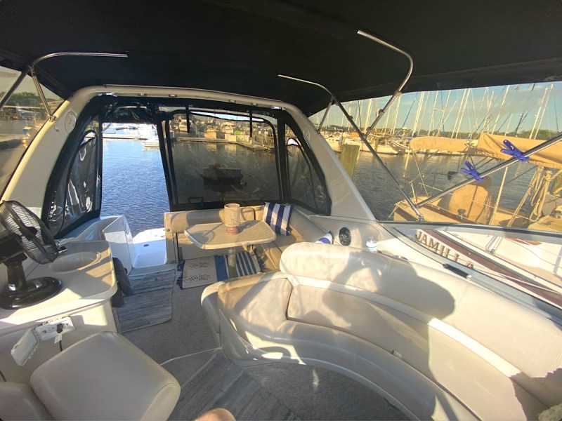 33' Regal Boat Rental with covered cockpit, wraparound lounge seating and dining area in Jacksonville, Florida.