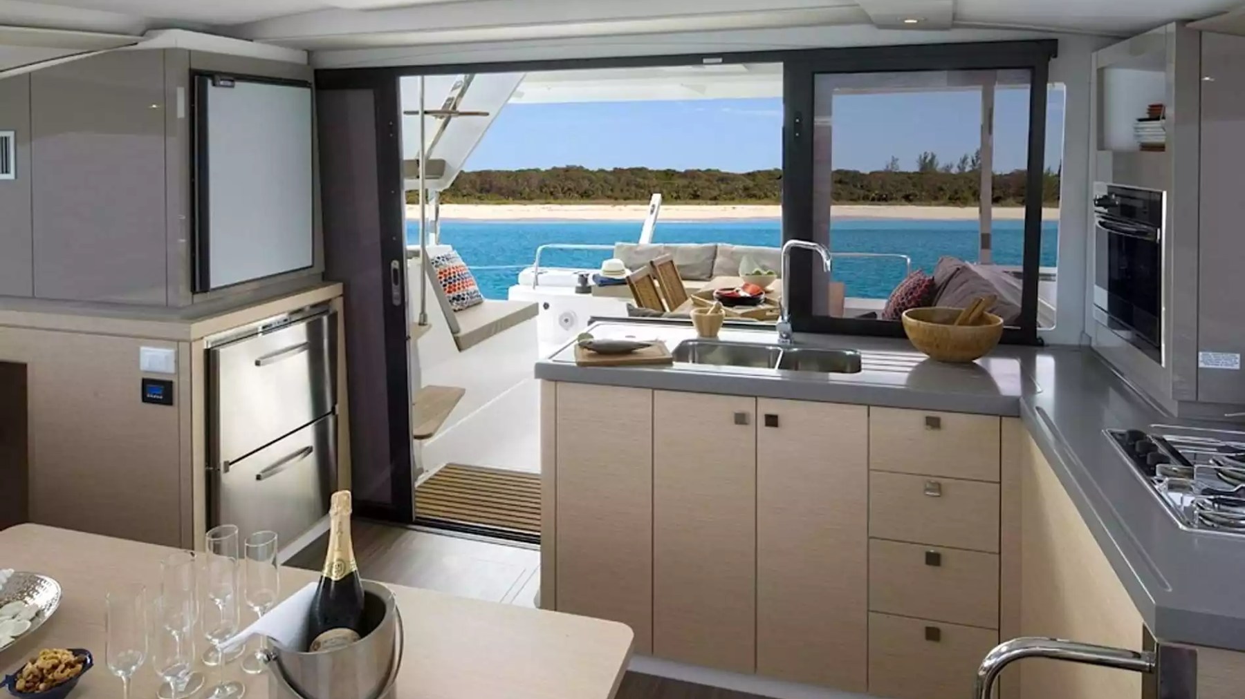 40' Fountaine Pajot Boat Rental with full galley, dining area and open access to the aft deck and tropical waters.