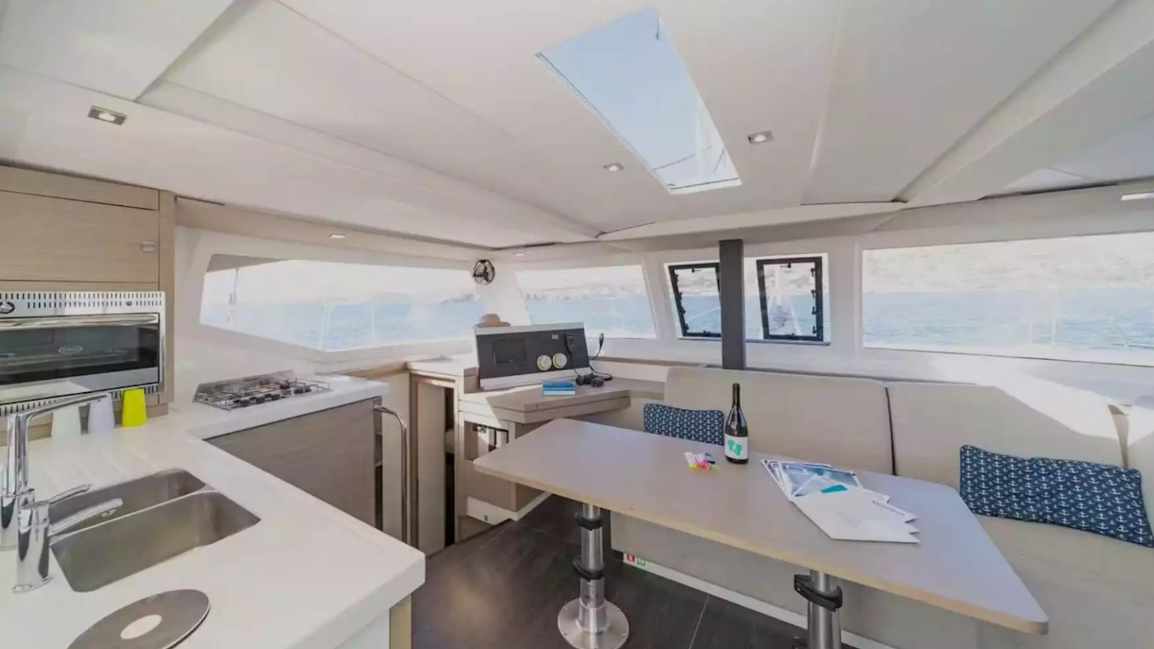 40' Fountaine Pajot Boat Rental with bright salon, full galley and panoramic windows overlooking the water.