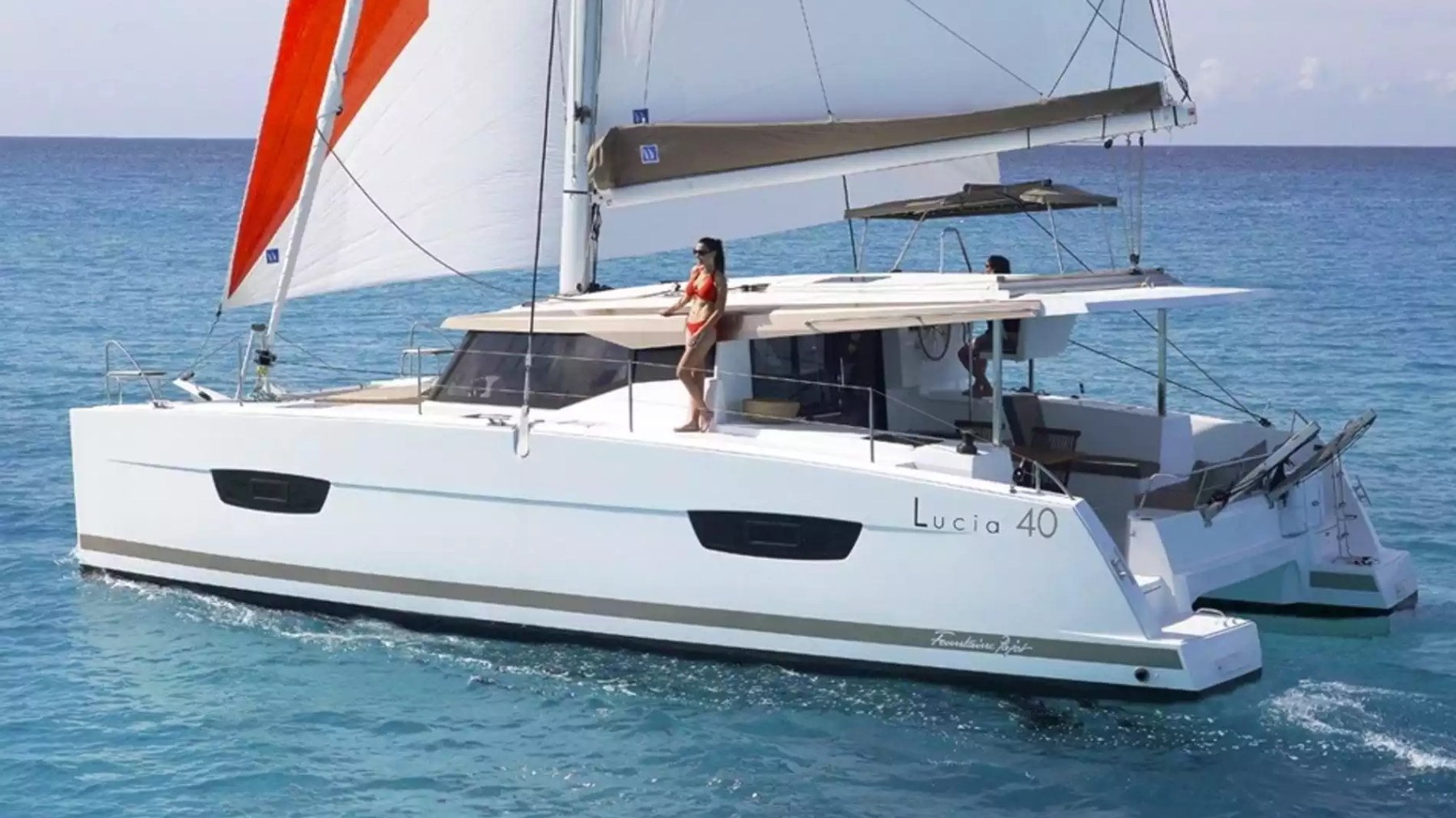 40' Fountaine Pajot Boat Rental sailing catamaran underway in tropical waters.
