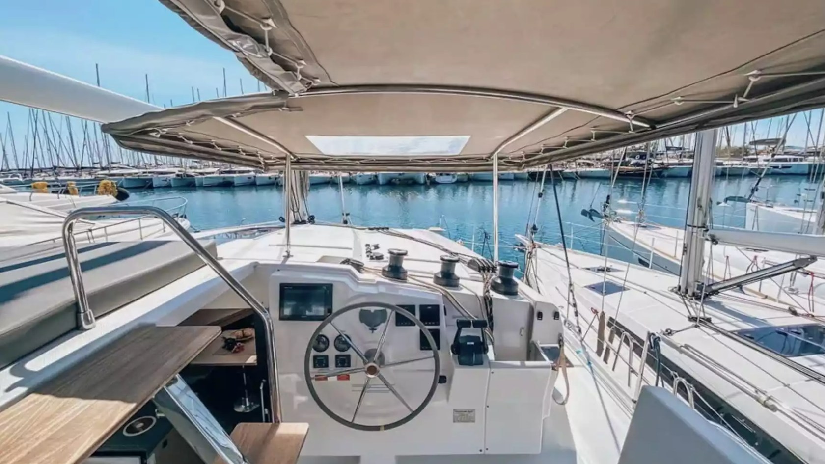 40' Fountaine Pajot Boat Rental with shaded helm station and elevated seating area.