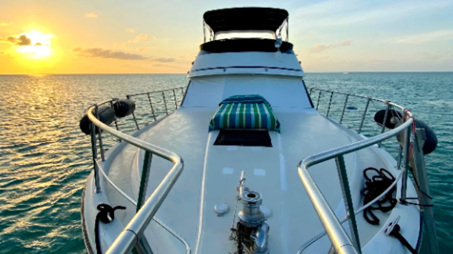 55' Californian Yacht Charter bow deck overlooking a tropical sunset in Key Largo, Florida.