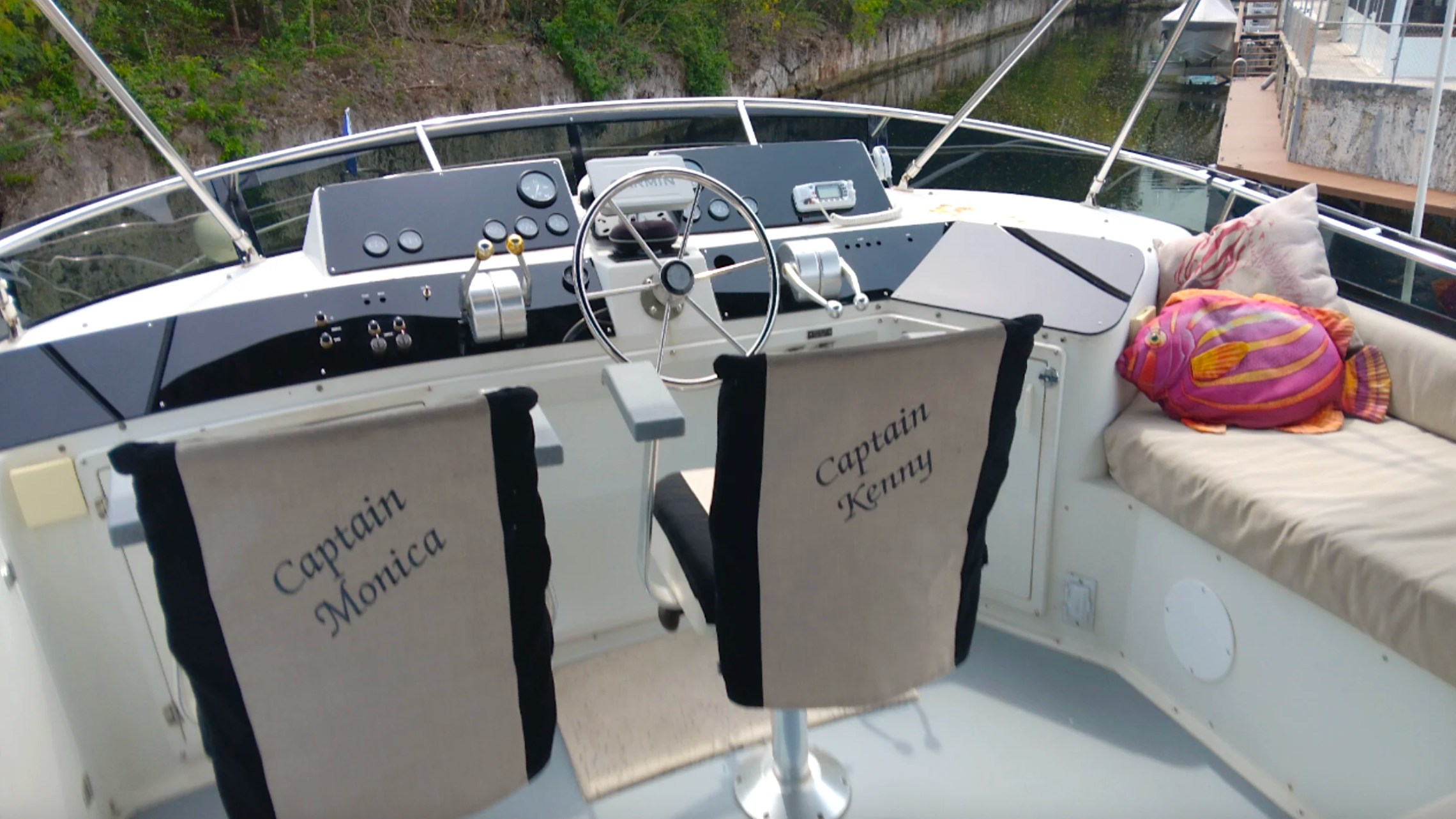 55' Californian Yacht Charter flybridge helm with captain chairs and lounge seating in Key Largo, Florida.
