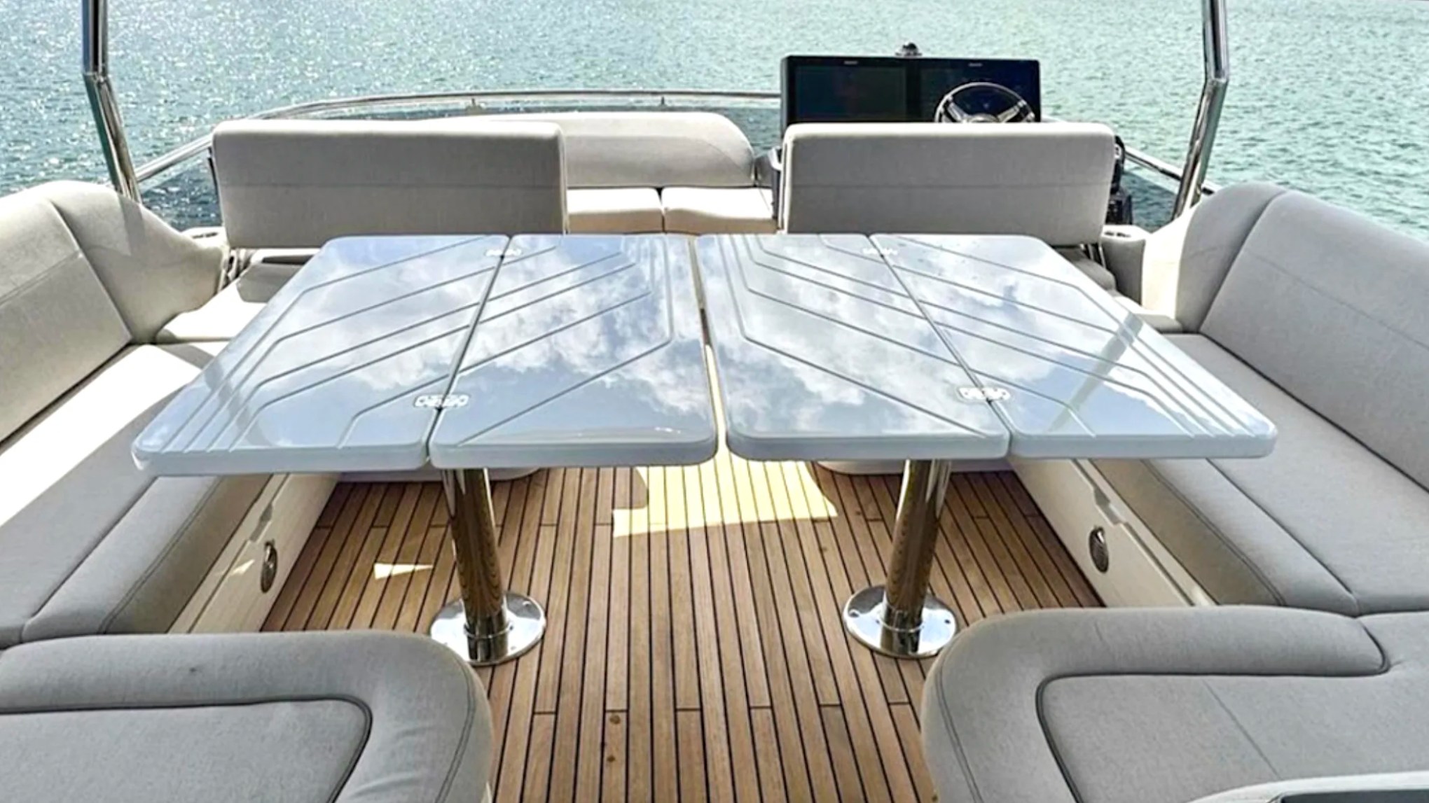 58' Galeon Yacht Charter flybridge with spacious dining tables and wraparound lounge seating in Fort Myers, Florida.