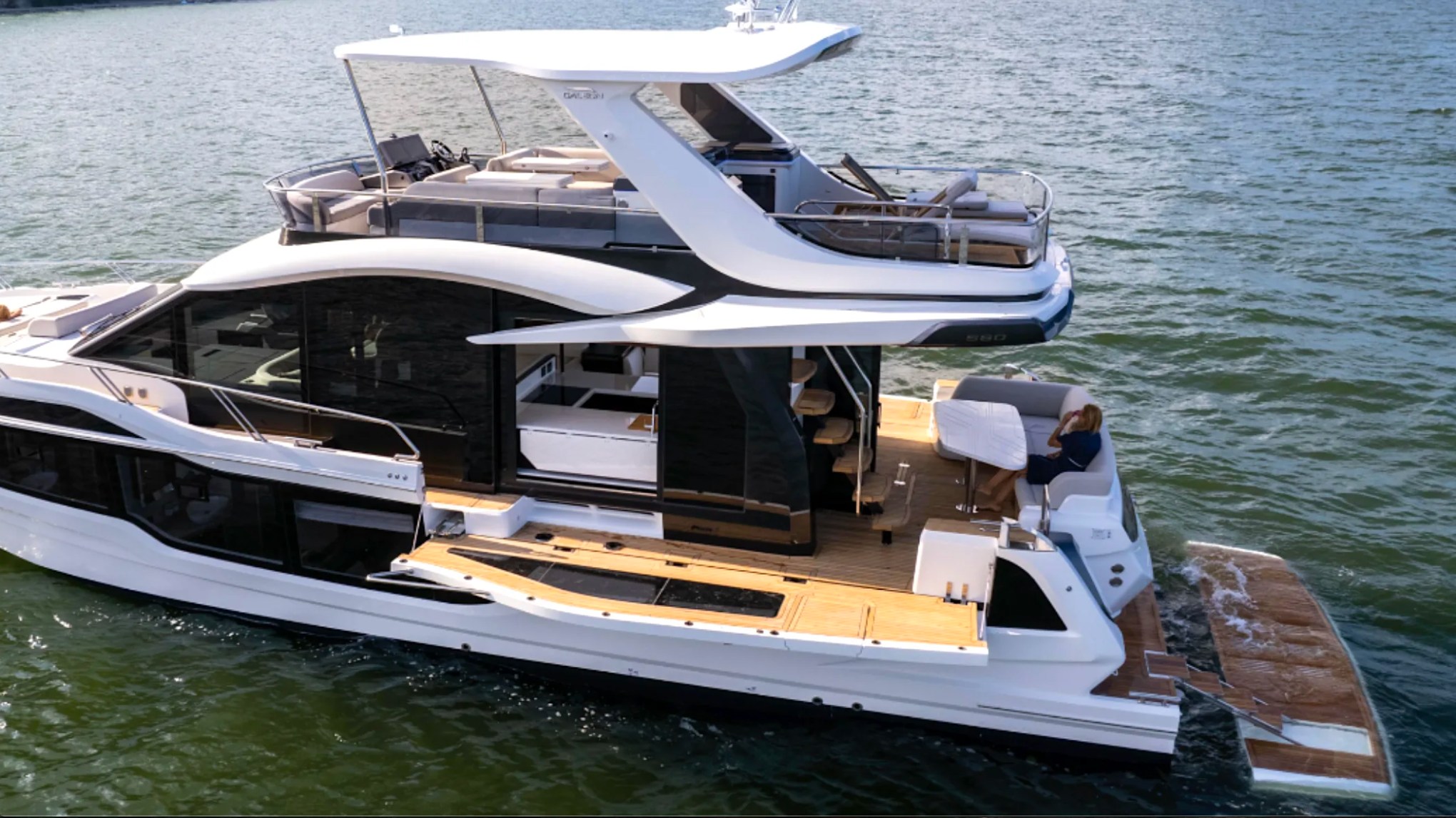 58' Galeon Yacht Charter with fold-out side deck, swim platform and flybridge in Fort Myers, Florida.