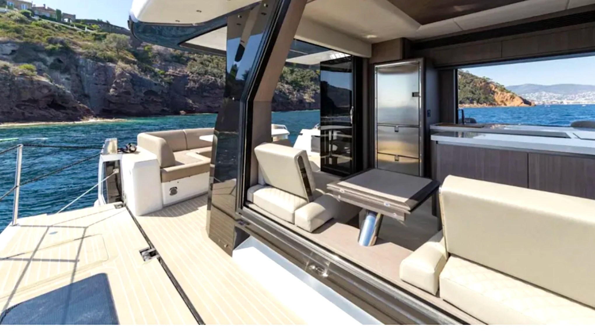 58' Galeon Yacht Charter with open side deck, dining area and waterfront views in Fort Myers, Florida.