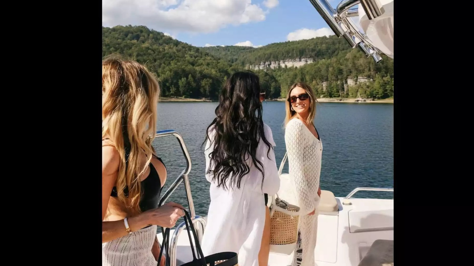 Axopar Boat Rental with friends enjoying the open aft deck and scenic waterfront views during a private boating adventure.