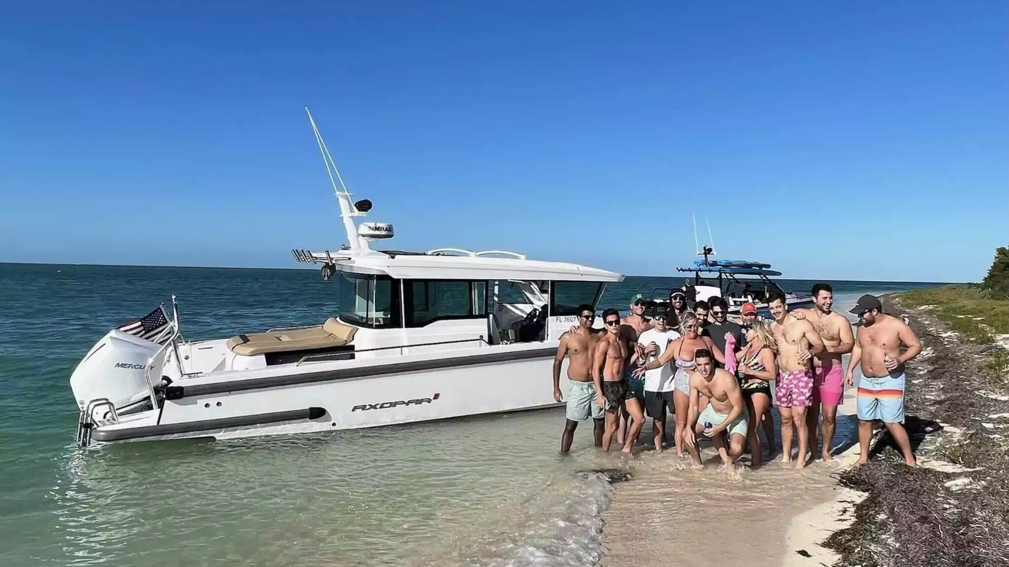 Axopar Boat Rental with a group of guests enjoying a tropical beach and sandbar stop.