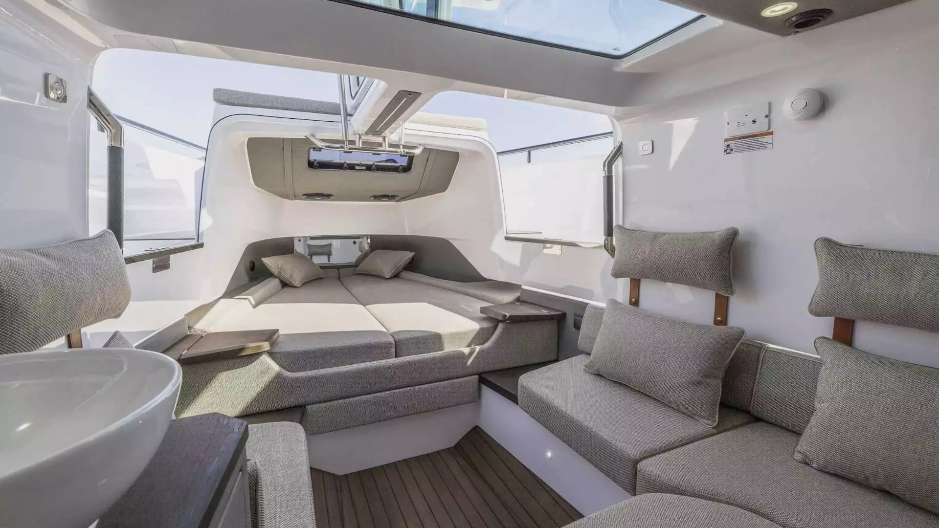 Axopar Boat Rental cabin with private berth, lounge seating and overhead skylight.