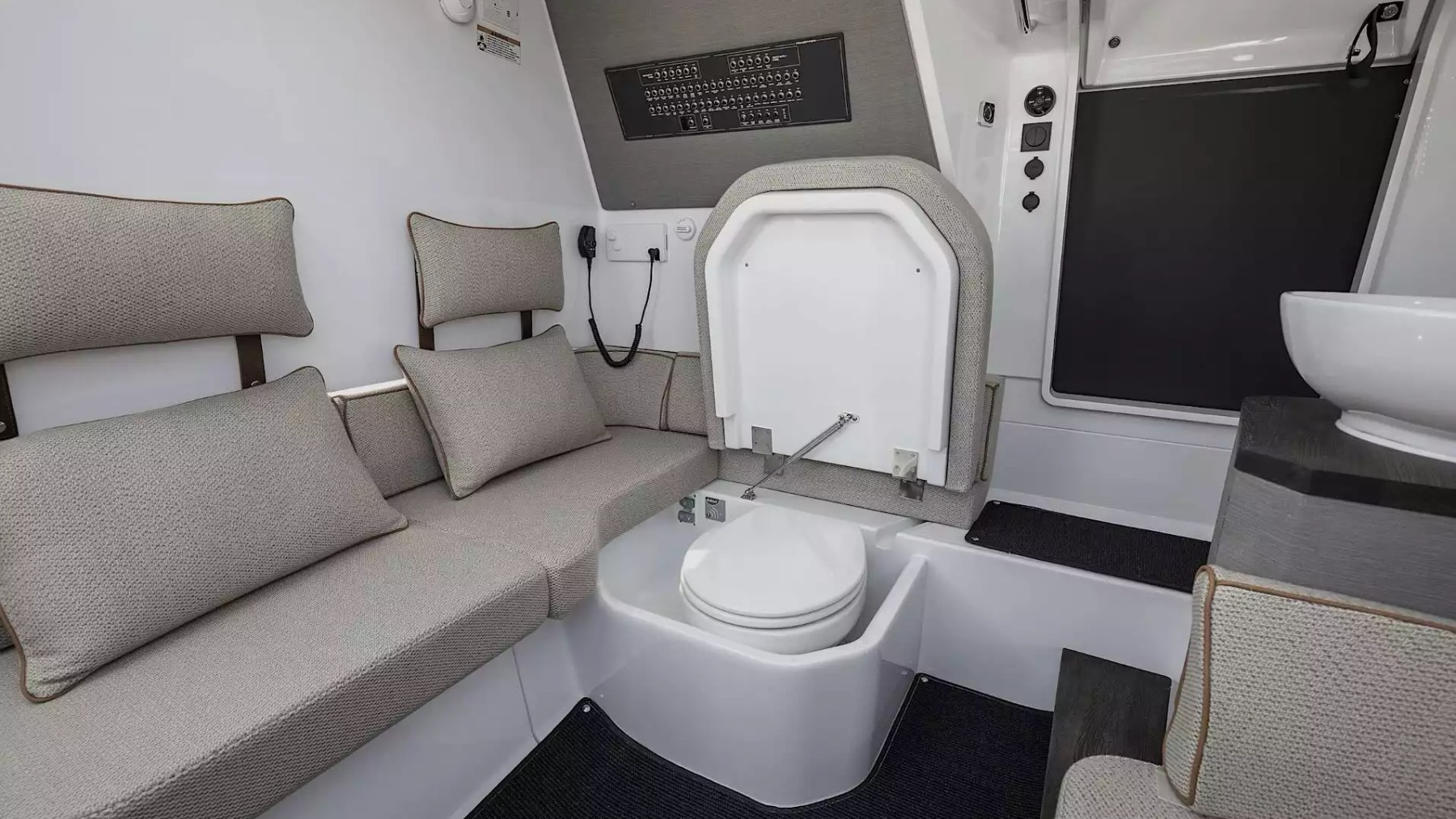 Axopar Boat Rental private cabin with enclosed marine head, lounge seating and vanity.