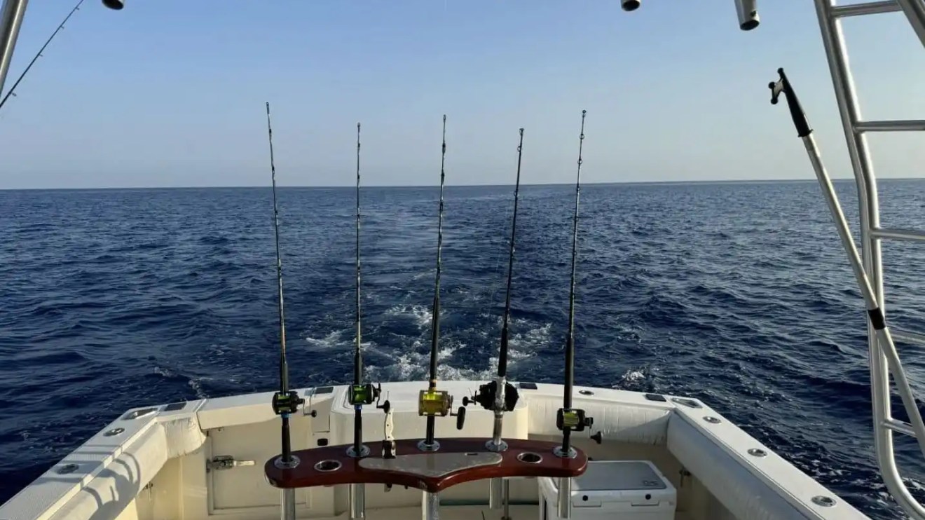 Key West Sportfishing Boat Rental with multiple offshore fishing rods set across the spacious cockpit.