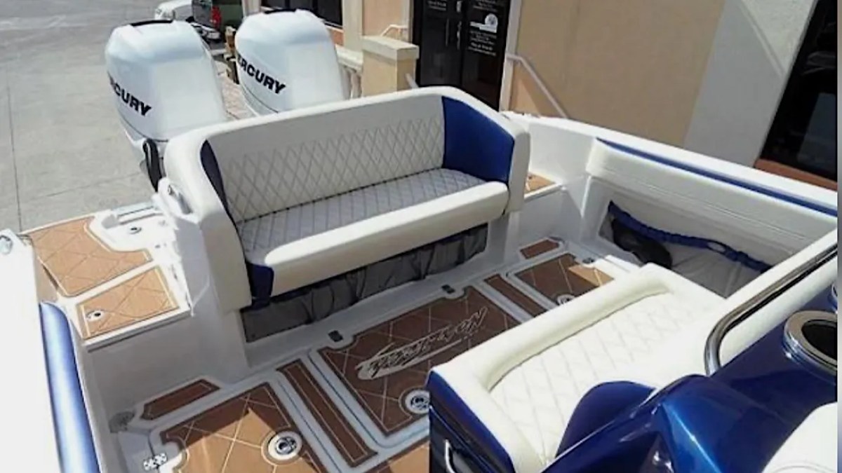 Nor-Tech Boat Rental with spacious aft lounge seating, premium deck flooring and twin Mercury outboards.