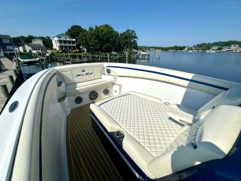 Nor-Tech Boat Rental with spacious bow lounge, wraparound seating and diamond-stitched sun pad overlooking Florida waters.
