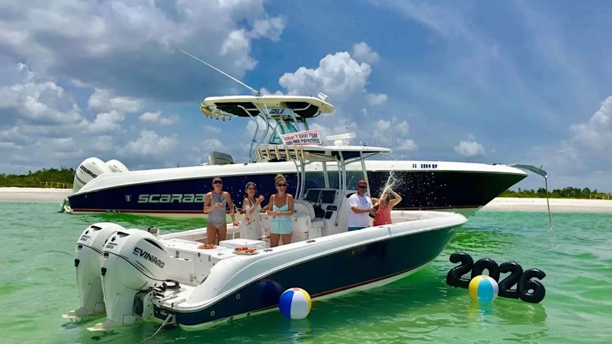 Scarab Boat Rental with guests celebrating at a tropical sandbar in South Florida.