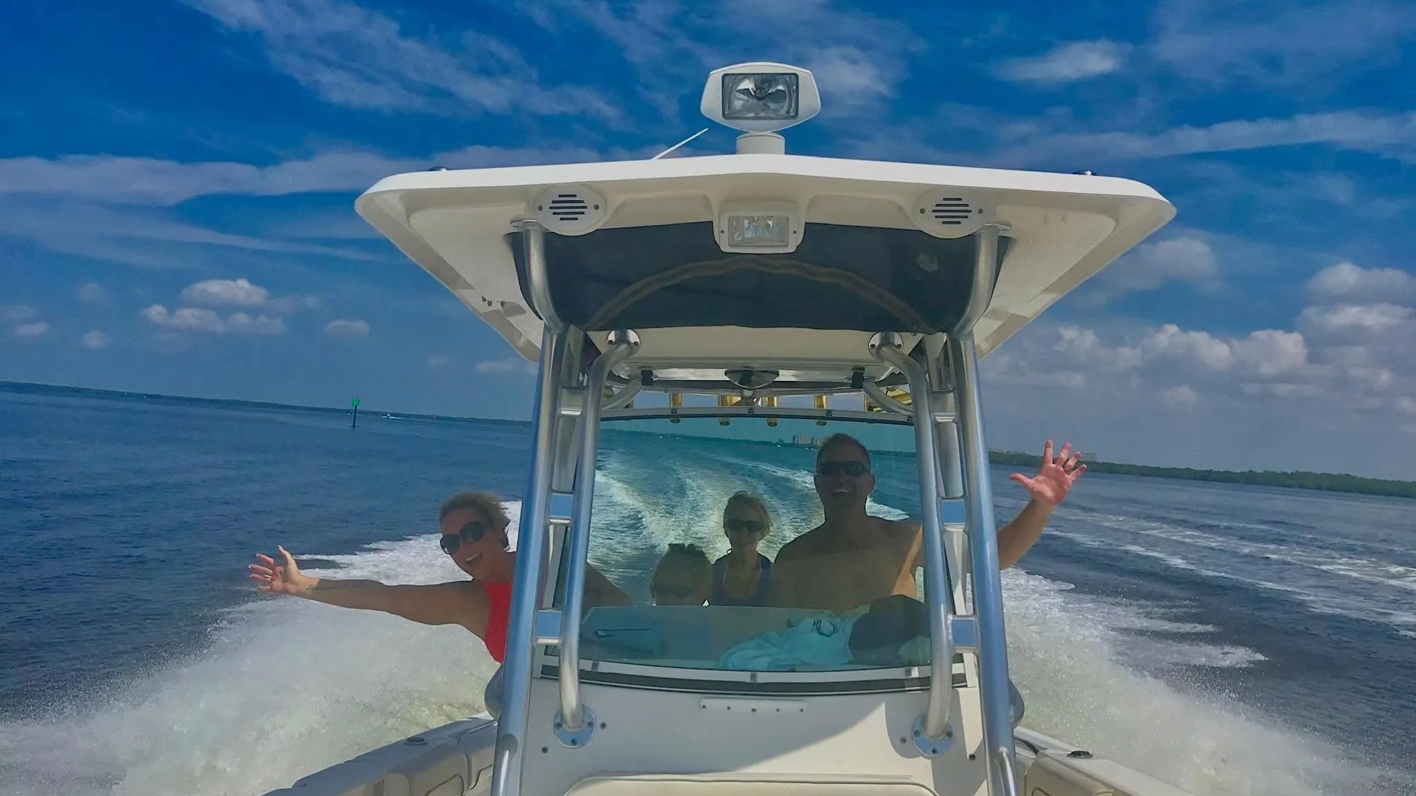 Scarab Boat Rental underway with guests enjoying a fast boating adventure on South Florida waters.