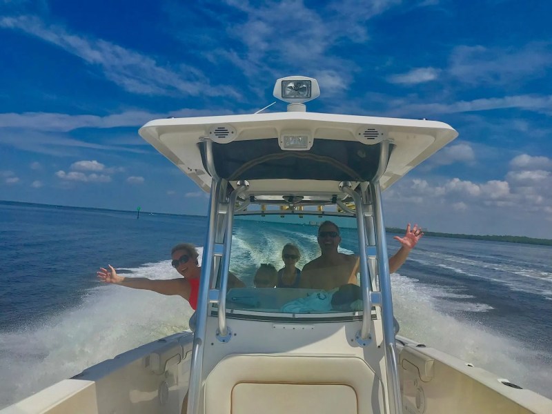 Scarab Boat Rental underway with guests enjoying a fast boating adventure on South Florida waters.